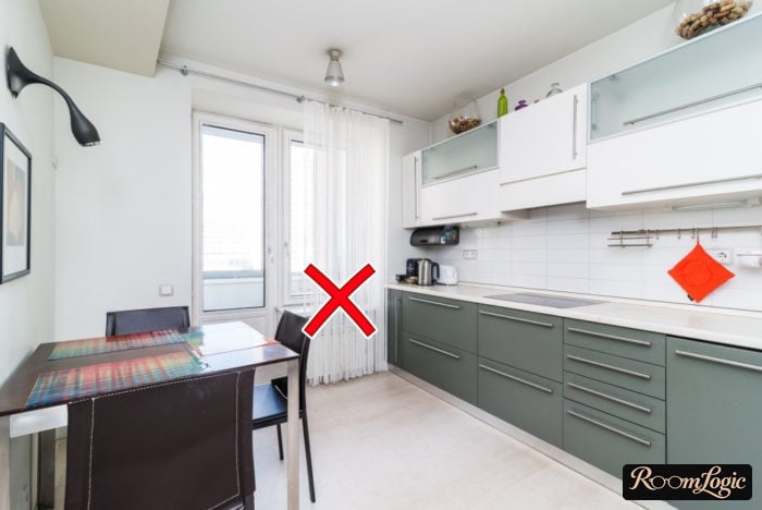 White lace curtains in the kitchen with a balcony