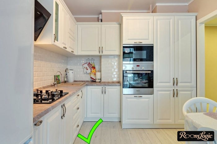 White laminate flooring in the interior of a kitchen in a neoclassical style