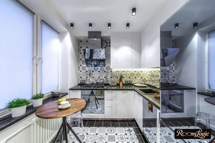 White roller shades in the kitchen of a tiny apartment