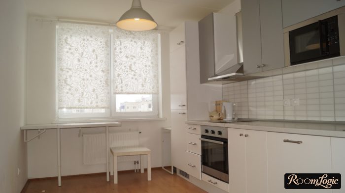 White roller shades with a pattern in the white kitchen