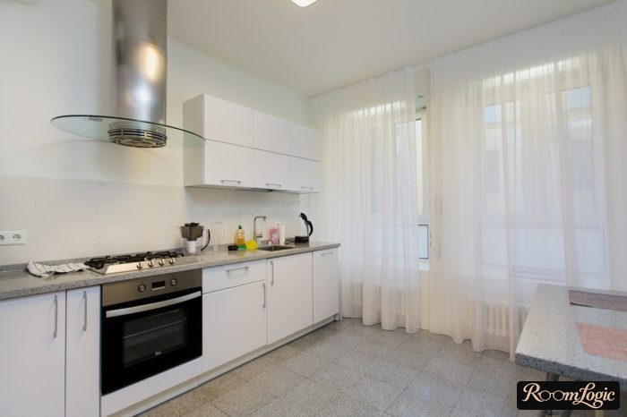 white sheer curtain on the kitchen with a large window