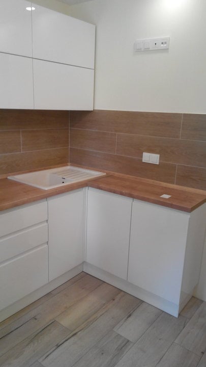 White sink made of artificial stone in the kitchen