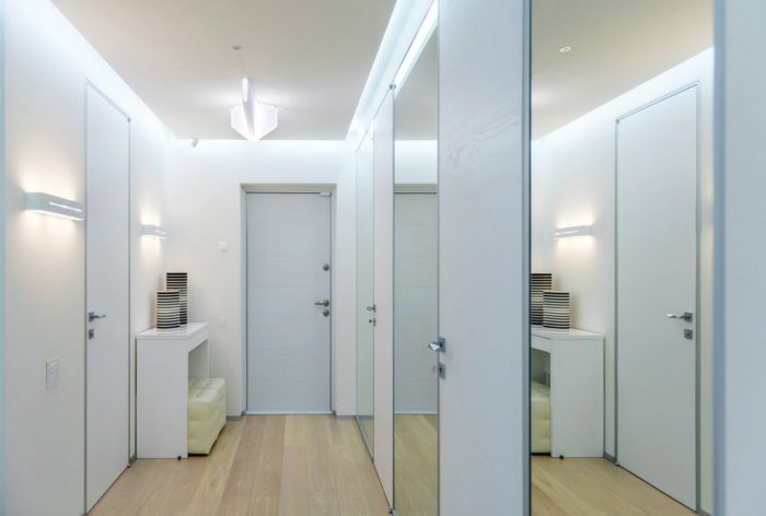 White sliding-door wardrobe in an entryway