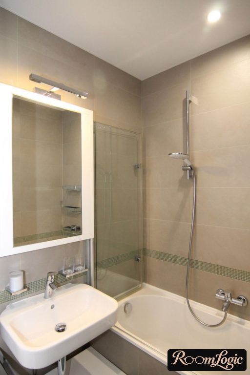 White stretch ceiling in a small bathroom
