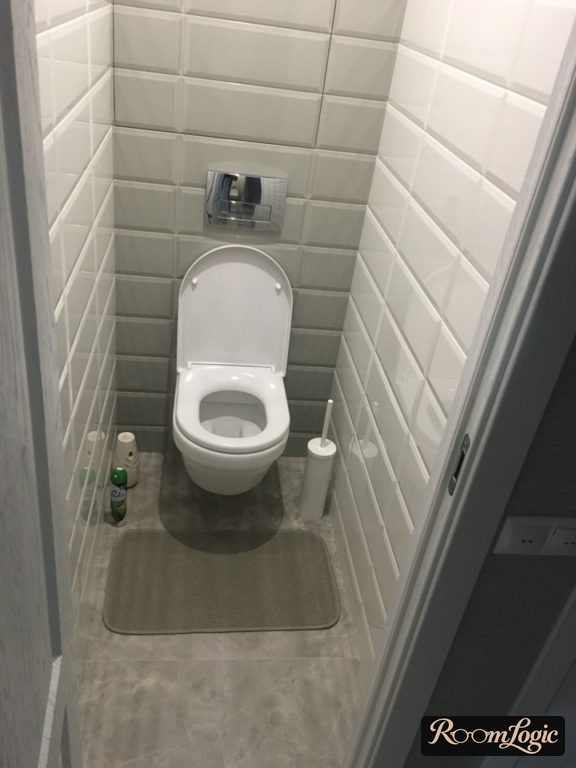 White subway tile in the toilet
