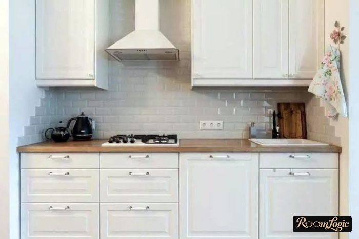 white subway tile on the kitchen backsplash in neoclassical style