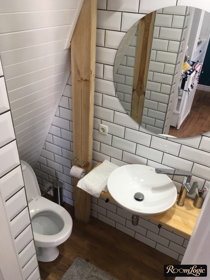 white subway tile with black grout in the bathroom