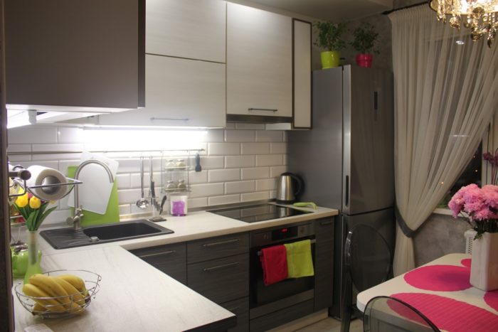 white subway tile with gray grout on the kitchen backsplash