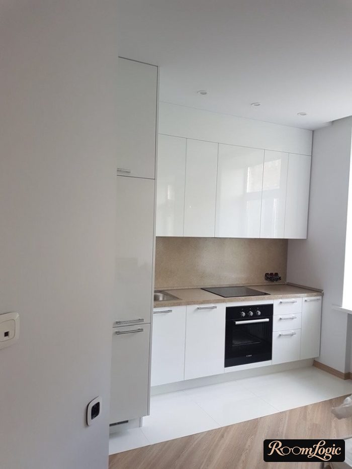 white tile floor in kitchen extending into parquet