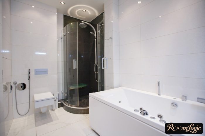 White tile in a room with a bathroom and shower