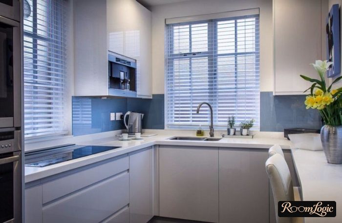 white U-shaped high-tech kitchen