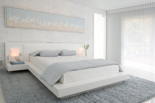 White walls and brickwork in the bedroom
