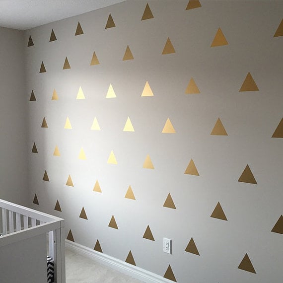 white walls with golden triangle wallpaper