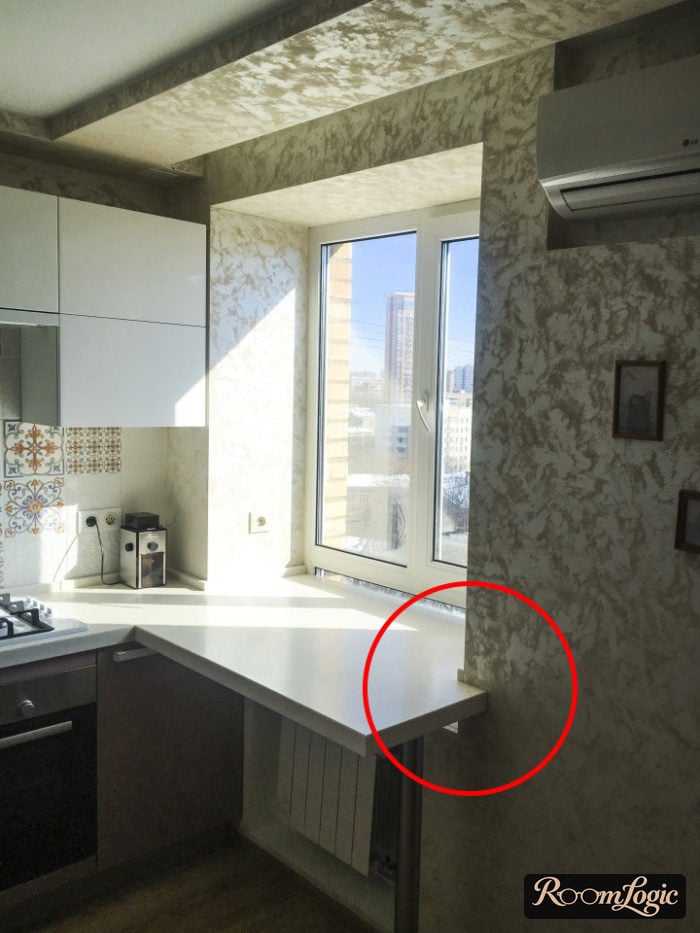 Window below countertop on the kitchen counter in a tiny apartment - example of using the window sill
