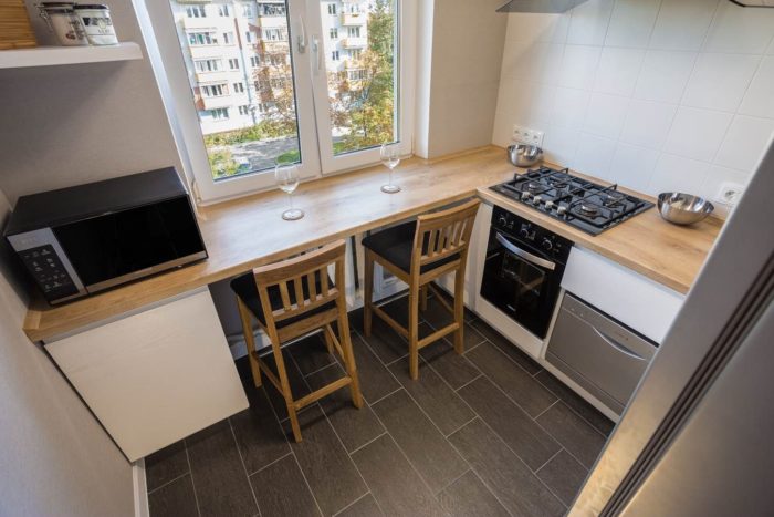 wood-look tile with white grout on the kitchen
