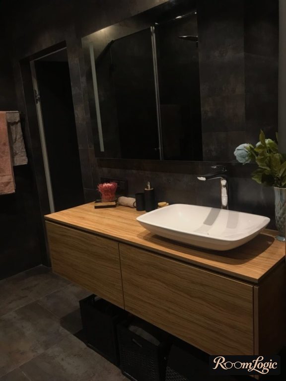 wood-look vanity with sink basin in bathroom