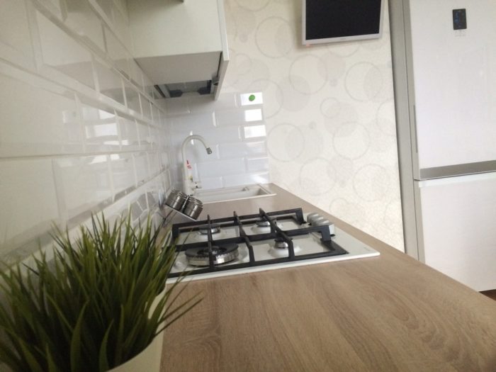 wooden countertop and white appliances