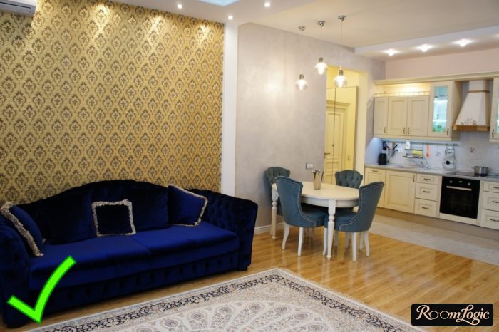 yellow wallpaper with pattern on accent wall in kitchen-living room