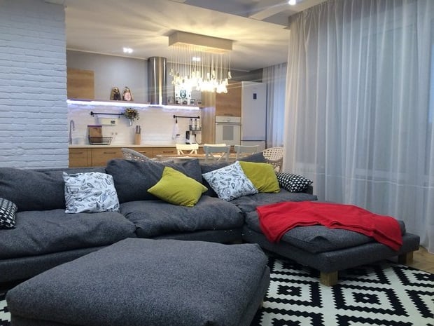 zoning of studio apartment with sofa